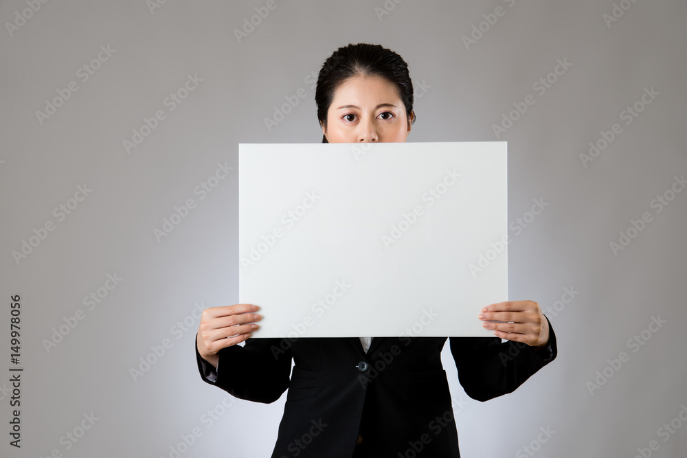 Businesswoman keep silence using a banner Businesswoman keep silence using a banner
