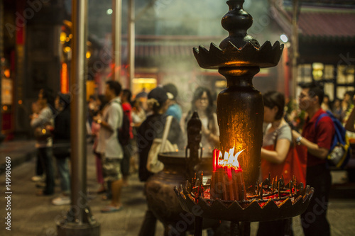 People praying and lighting incense at Longshan Temple in the center of the city