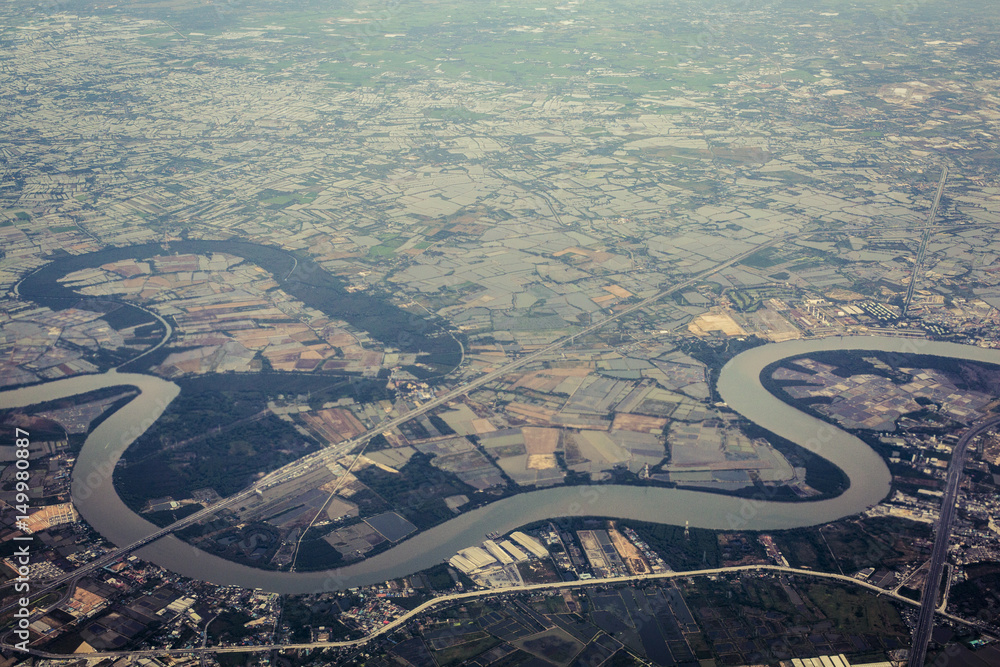 Aerial view of river and farm land Aerial view of river and farm land