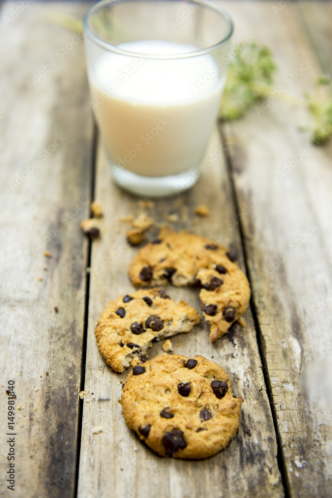 Glass of milk and cookies on wooden table. Top view Glass of milk and cookies on wooden table. Top view