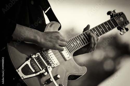 Close up of man playing a guitar