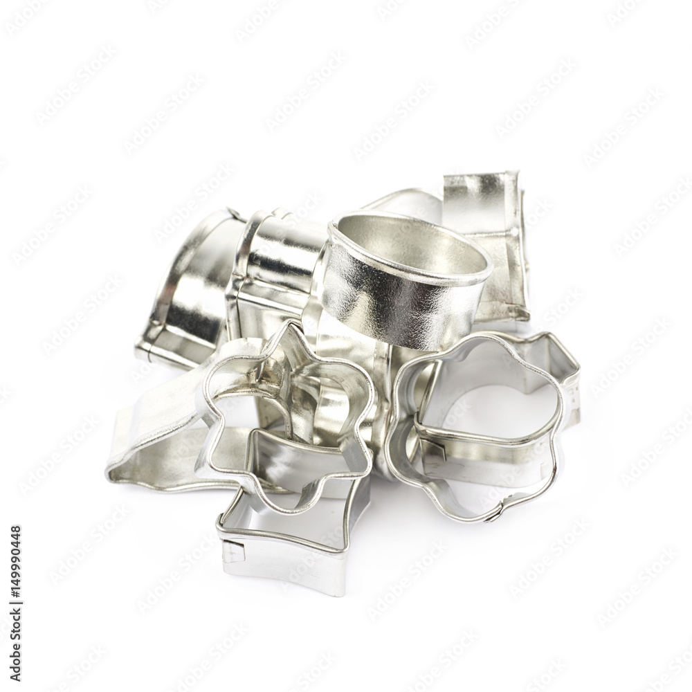 Pile of metal cookie cutters isolated Pile of metal cookie cutters isolated