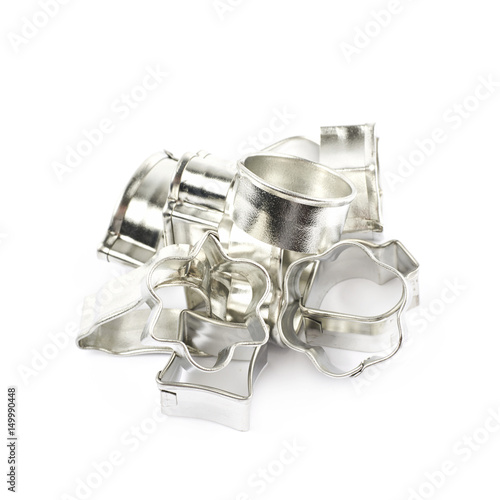 Pile of metal cookie cutters isolated