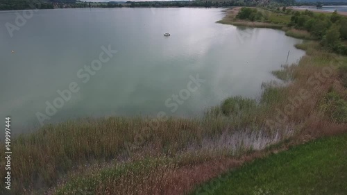 From shore to boat - flying up over lake and fieds - St.Peters Island photo