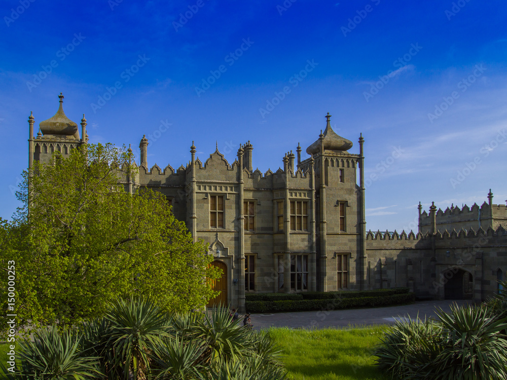 Building of Vorontsov Palace at sunset from park, Crimea, Alupka