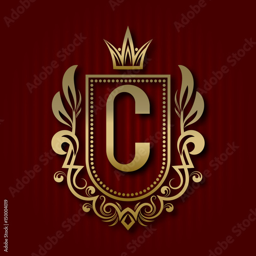 Golden royal coat of arms in medieval style. Vintage logo with C monogram.
