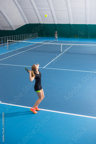 The young girl in a closed tennis court with ball © master1305