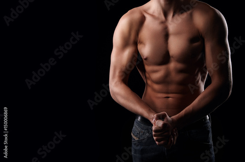 Handsome young man with muscular physique