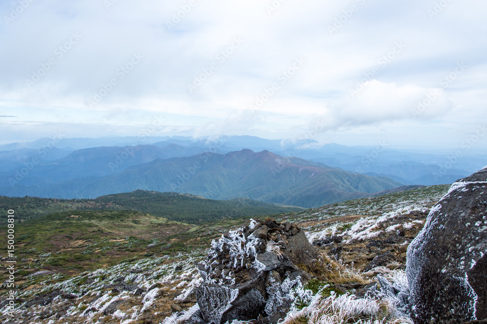 Fototapeta premium Frozen branches in front of a mountain range, Japan, in Asia - Stock image