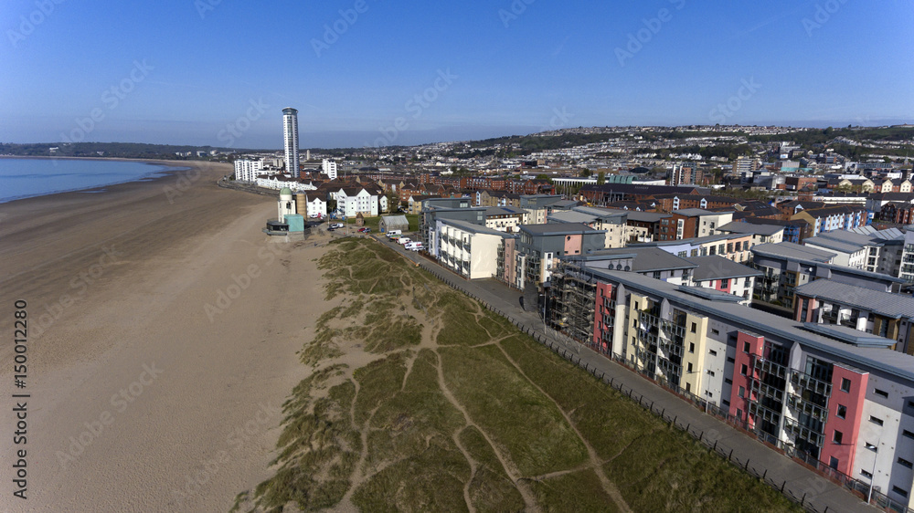 Editorial SWANSEA, UK - APRIL 19, 2017: An aerial view of the new coastal housing and the Meridian Tower at the marina sea front area of Swansea Bay, South Wales
