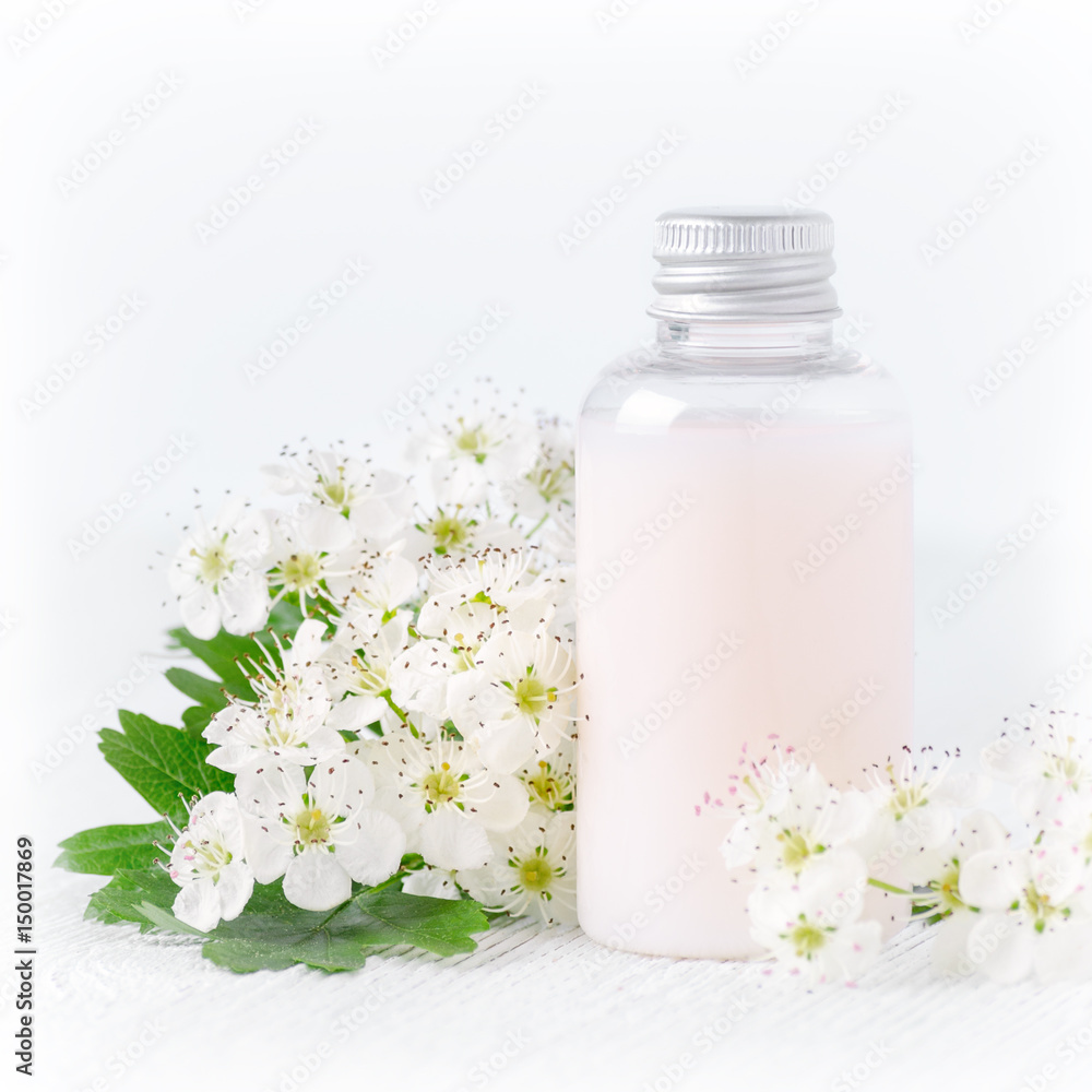 a bottle of natural baby cosmetic with flowers a bottle of natural baby cosmetic with flowers