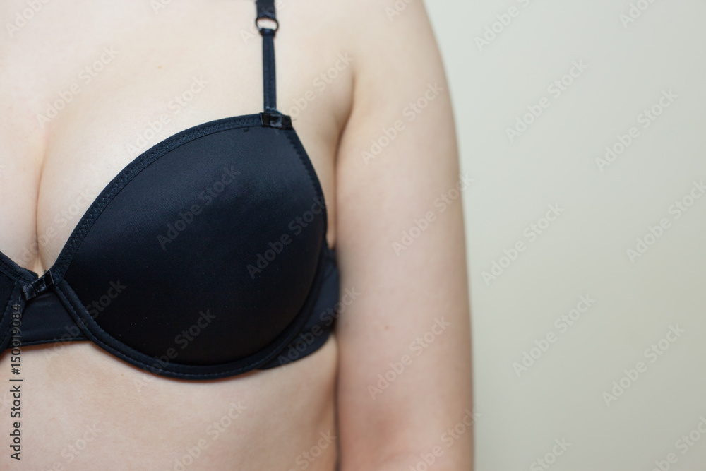 Brest of young woman with black bra Stock Photo