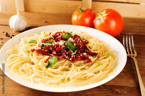 Italian dish - pasta with sundried tomato and basil
