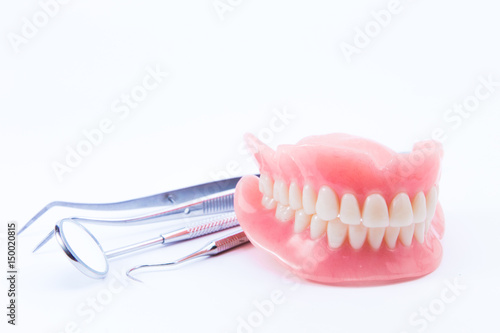 teeth and dental mirror, symbol photo of dentures, diagnosis and copayment