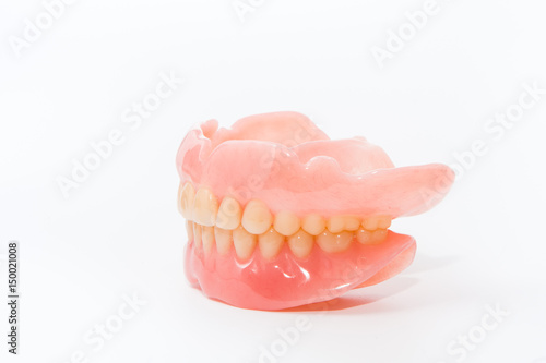 complte denture on white background
