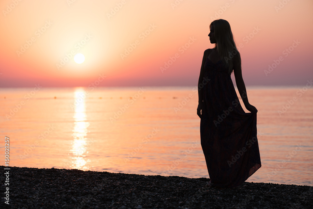 Girl meets the dawn on the beach Girl meets the dawn on the beach