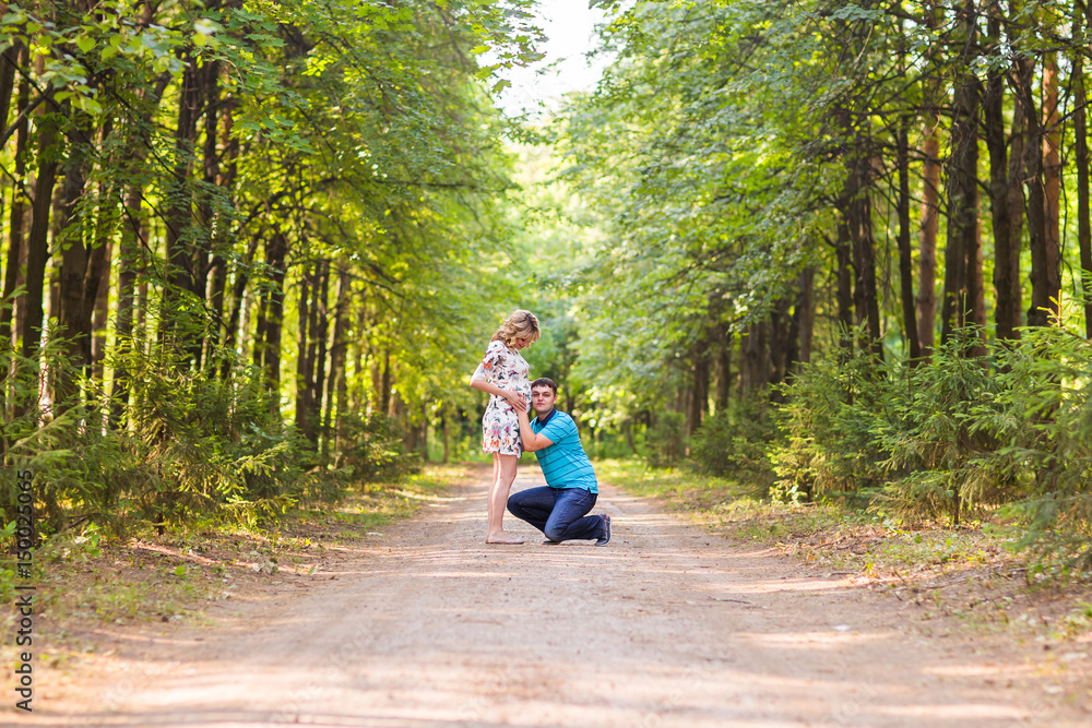 Fototapeta premium Happy beautiful pregnant woman and her husband