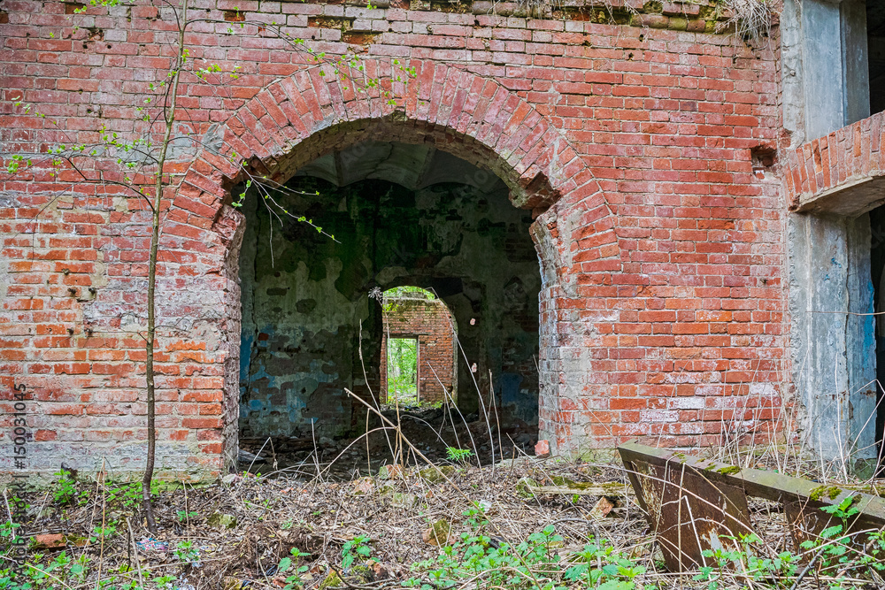 Old abandoned factory building in the forest in Moscow region, Russia