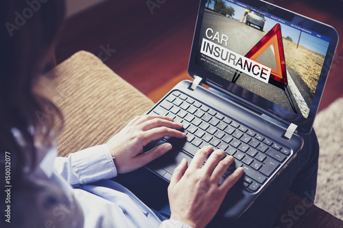 Car insurance website in a laptop screen.