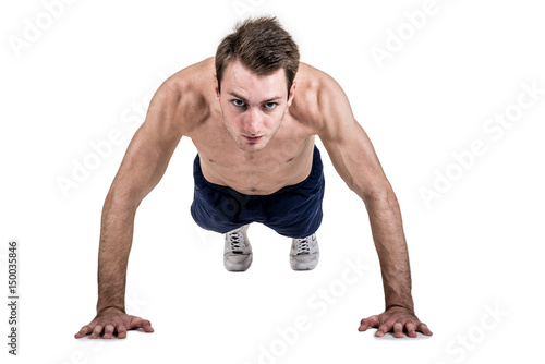 Healthy lifestyle and fitness. Beautiful guy sportive physique, with a naked body, push-up, isolated on a white background. Horizontal frame
