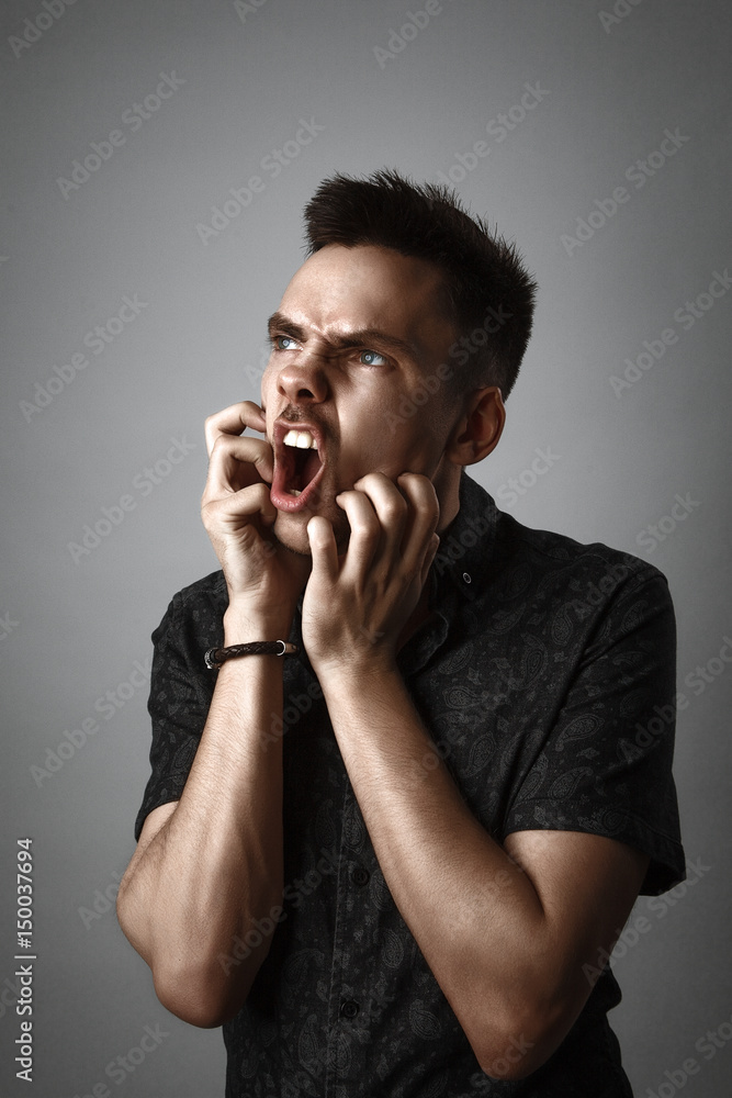 portrait of young angry man portrait of young angry man