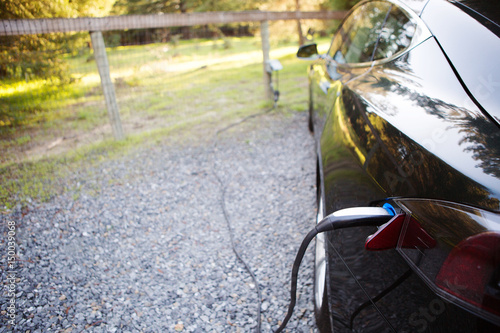 Electric car being recharged photo