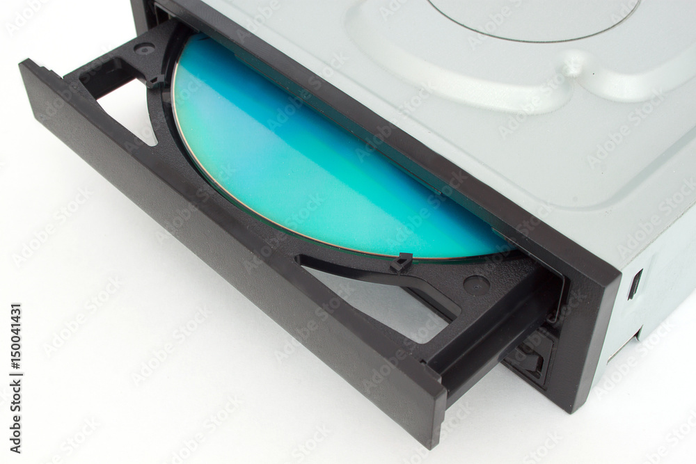 Open-ended CD - DVD drive with a black cap and disk inside. Open-ended CD - DVD drive with a black cap and disk inside.