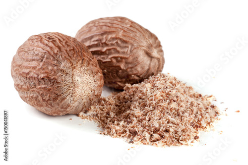 two nutmeg and powder isolated on white background