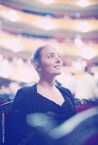 Woman in auditorium of teatre photo