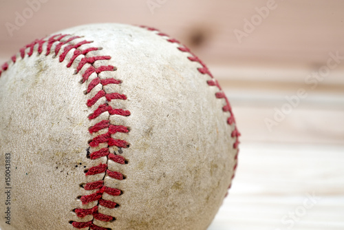 Close up macro view of the seams on a used baseball