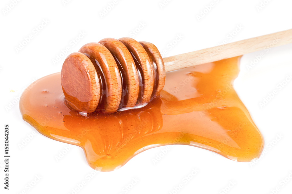 Honey stick with flowing honey isolated on white background Honey stick with flowing honey isolated on white background