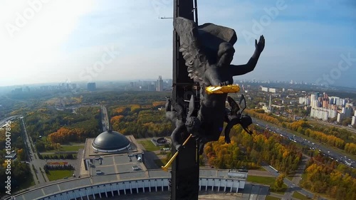 Poklonnaya Hill. Victory Park obelisk  with a statue of Nike and a monument of St George slaying the dragon. Moscow city Russia. Unique view city. Summer sunny day. Aerial Fly around  close to