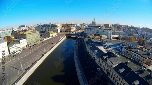 Crimea picturesque embankment bridge road traffic. Moscow river Old historical building roofs center. Peter Statue Vodootvodny Canal Smoke from pipes. Russia. Summer blue sky. Aerial above approach