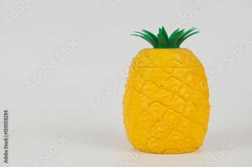 Tissue paper holder. Pineapple plastic orange on white background. Isolated.