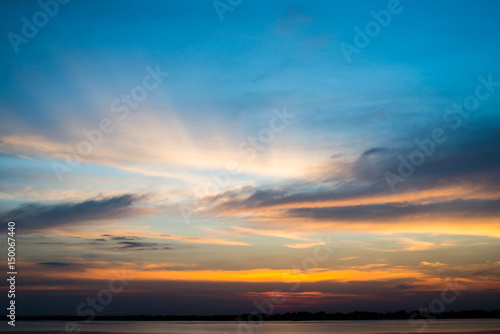 Silhouette with sunset sky at lake.