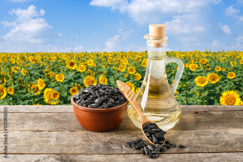 sunflower oil and seeds on table