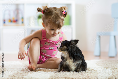 Little girl playing with he...