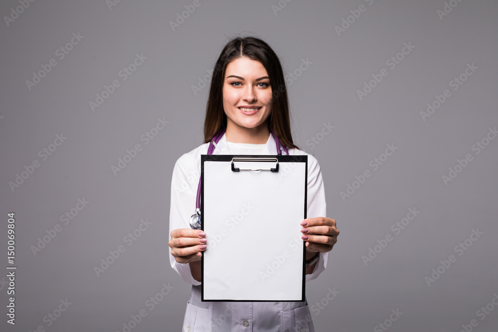 Young female doctor holding empty folder with files of desease illness. Specialist point by pen blank clipboard. Woman in medical uniform with stethoscope. Young female doctor holding empty folder with files of desease illness. Specialist point by pen blank clipboard. Woman in medical uniform with stethoscope.
