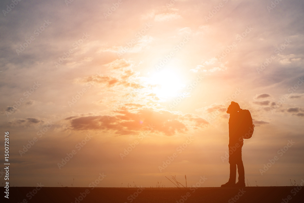 Silhouette of young man traveler.
