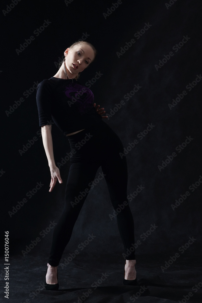 Vogue dancer posing on dark background Vogue dancer posing on dark background