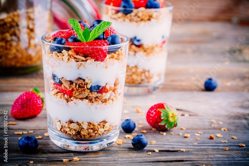 Yogurt parfait with granola,  strawberries and blueberries