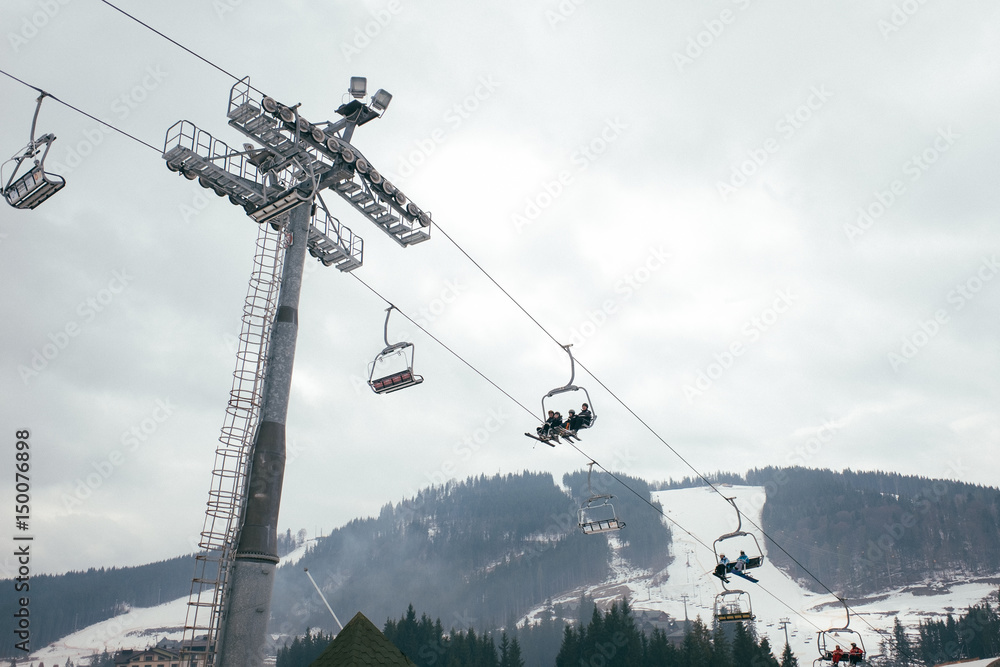 People climb the mountain at the lift People climb the mountain at the lift