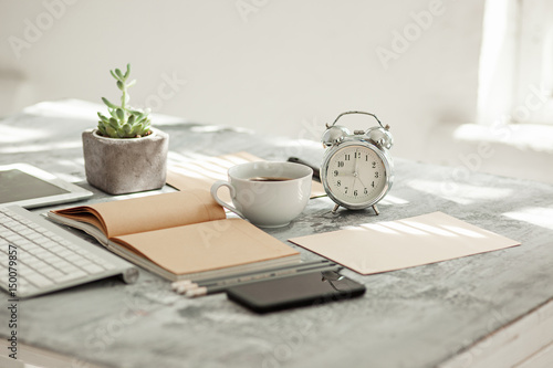 Office desk table with computer, supplies and phone