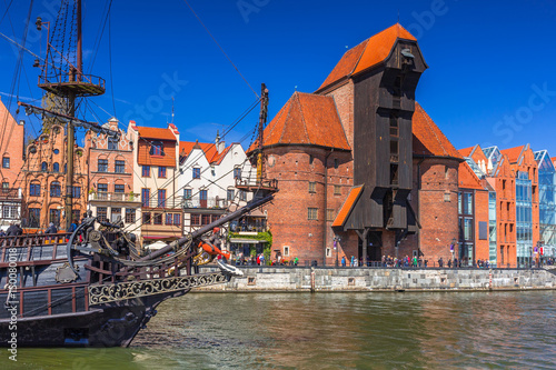 Pirate ship and historic port crane at Motlawa river in Gdansk, Poland