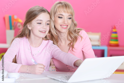 Mother and daughter doing lessons 
