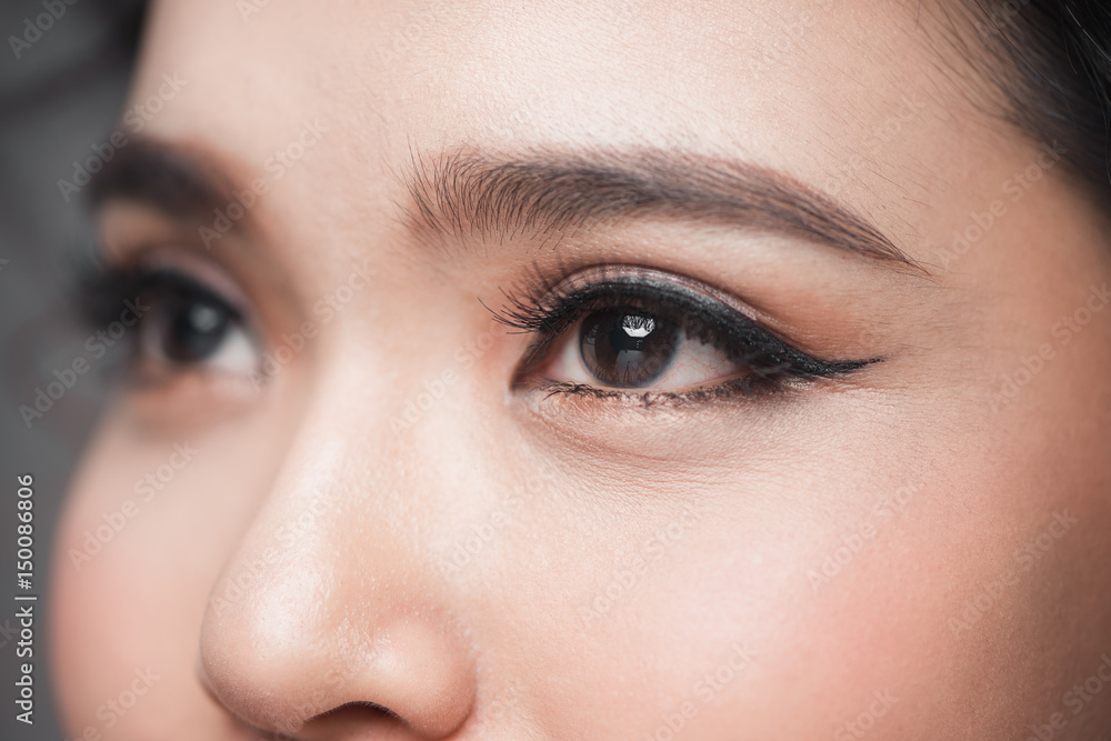 Asian model eye close-up with long eyelashes. Selective focus Asian model eye close-up with long eyelashes. Selective focus