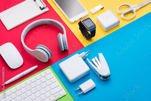 Well organised white office objects on colorful background photo