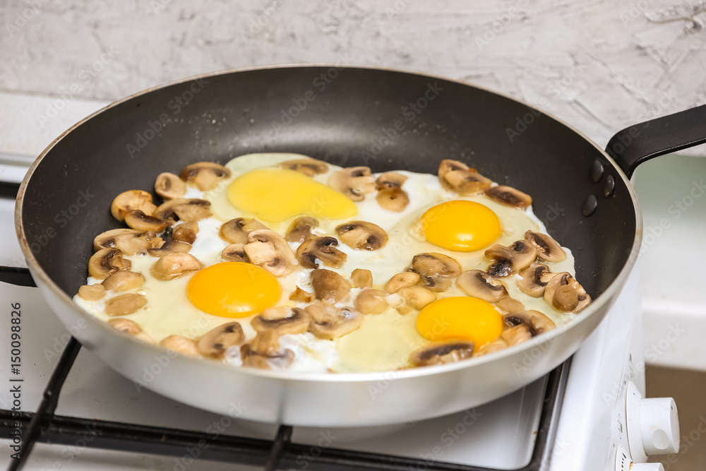 Fried eggs with mushrooms for a breakfast Fried eggs with mushrooms for a breakfast