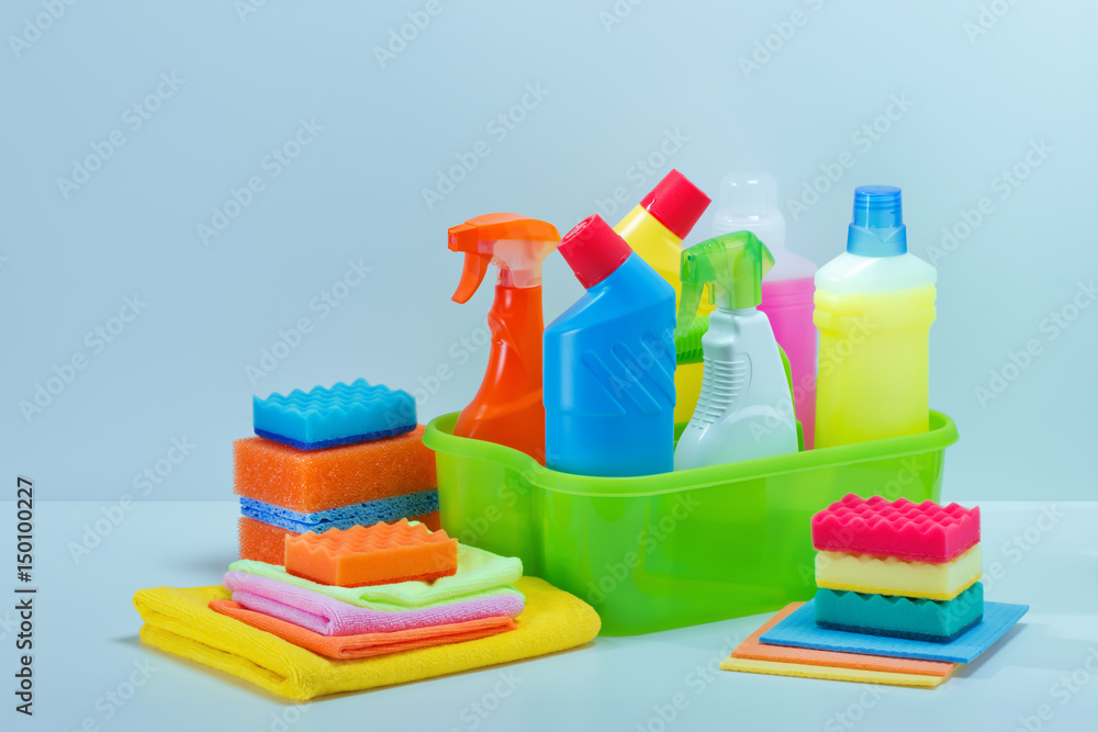 Basket with cleaning product on table Basket with cleaning product on table