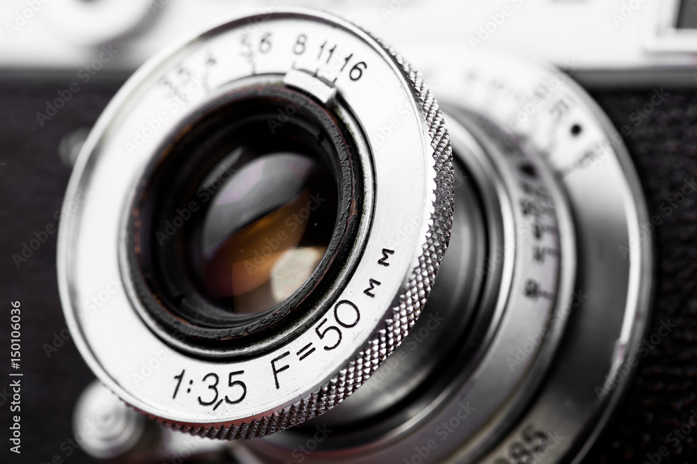 Old camera on white background on desk